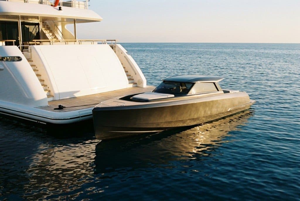 Tender alongside the stern of a superyacht