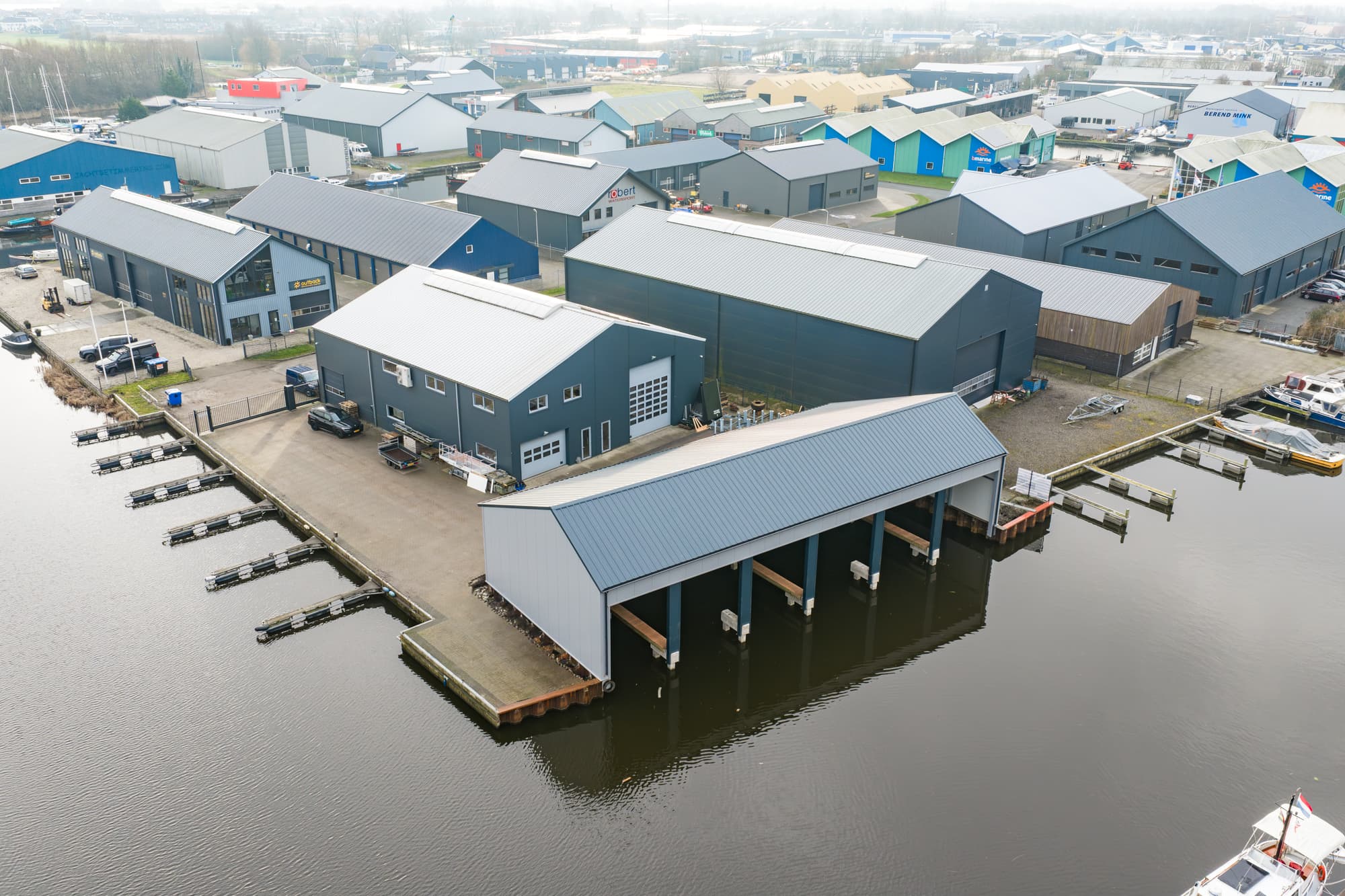 Aerial view of the yard in Grou with boat sheds and berths