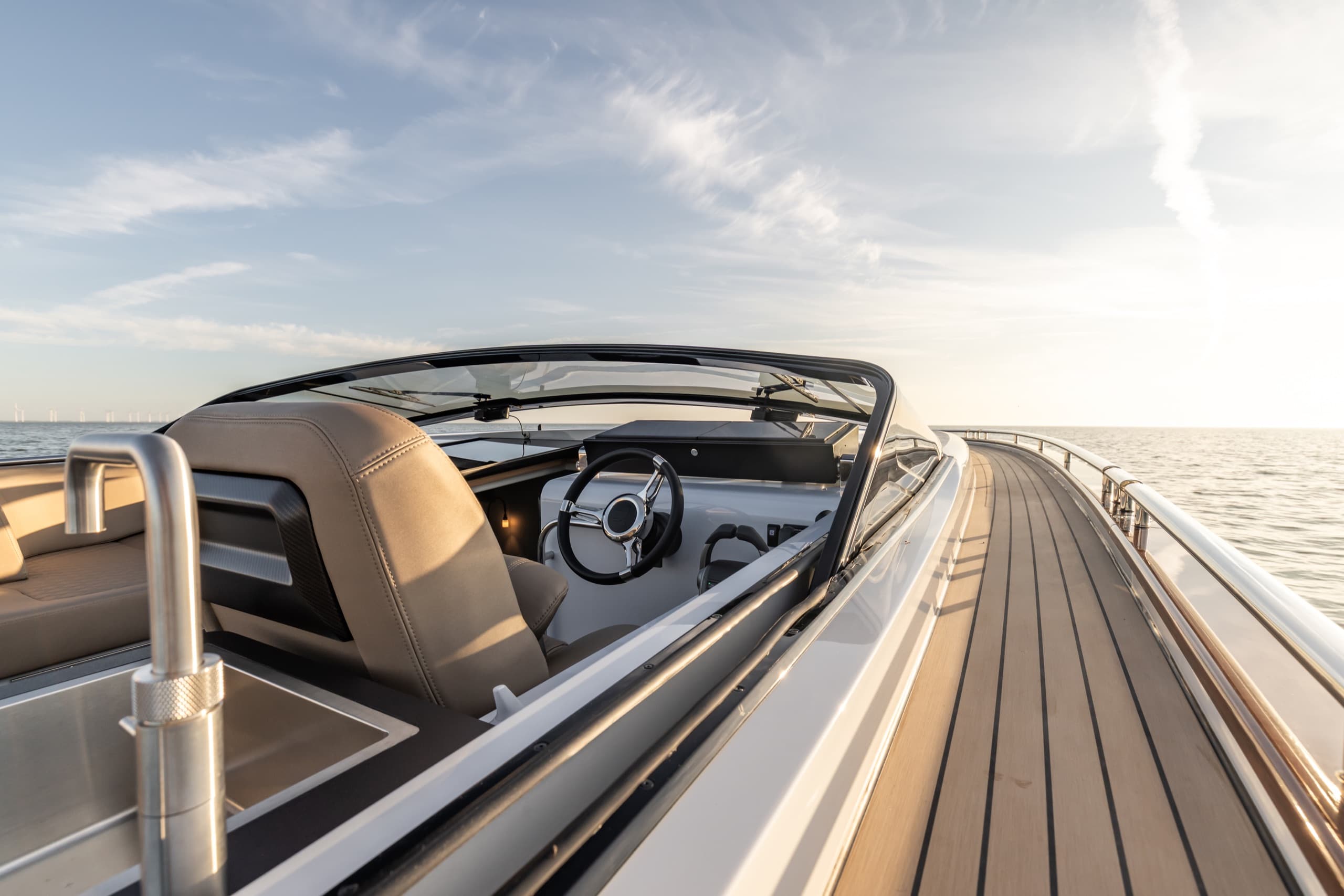 Helm of the Tristian 44 seen past the side window and the teak side deck